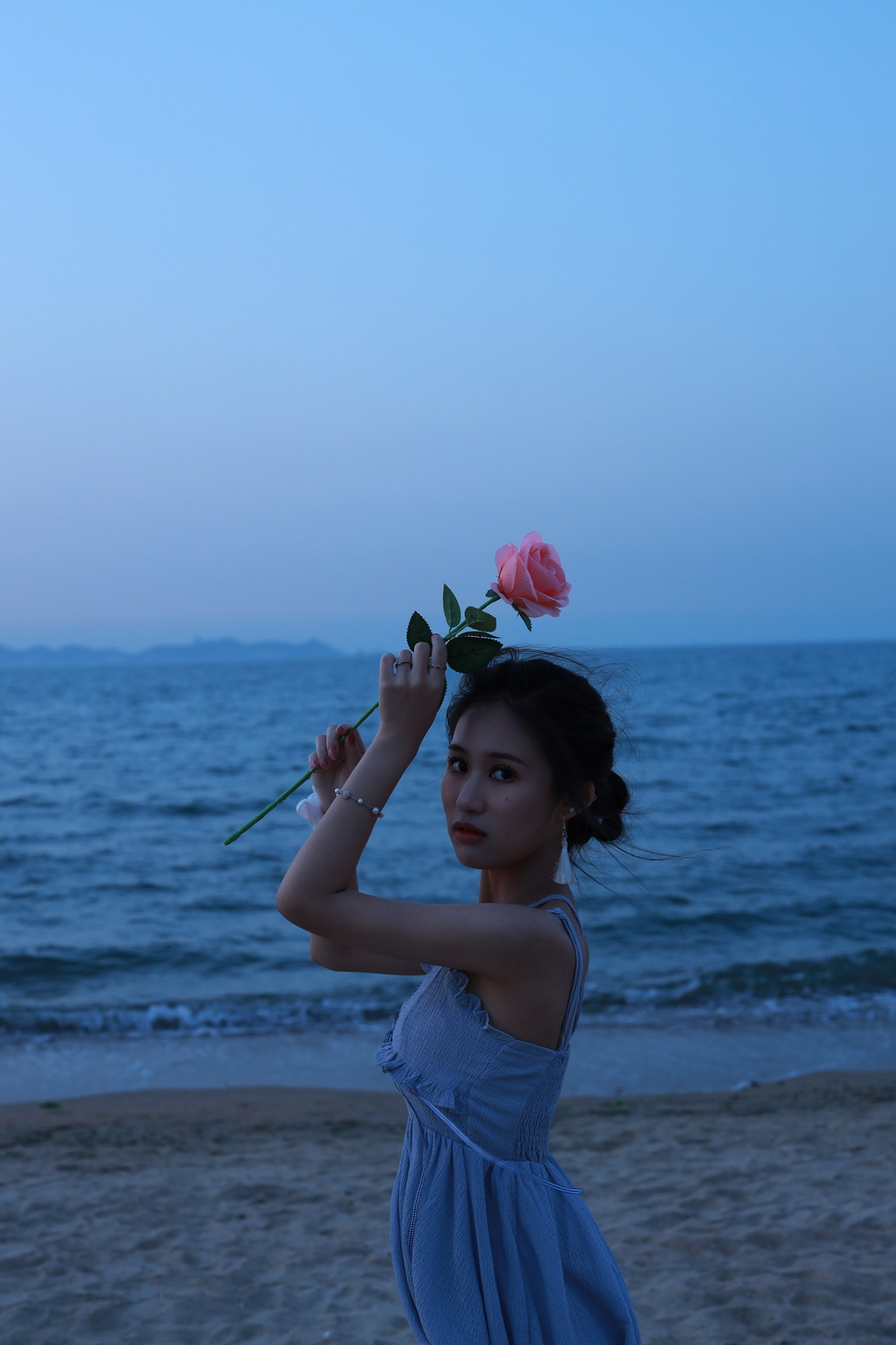 Woman with sunglasses walking down runway